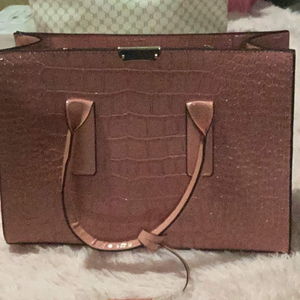 New purse comes with extra straps inside